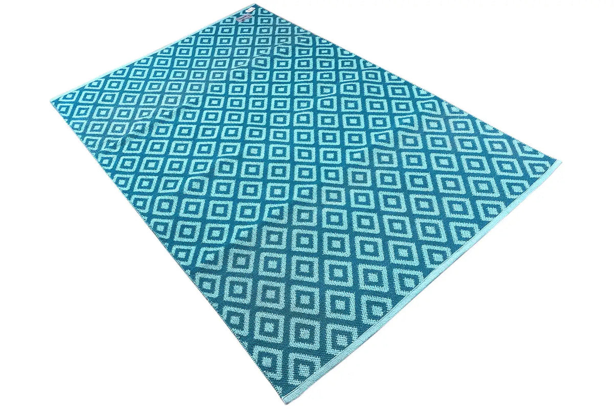 Blue kilim with a twisted square pattern and contrasting light blue lines