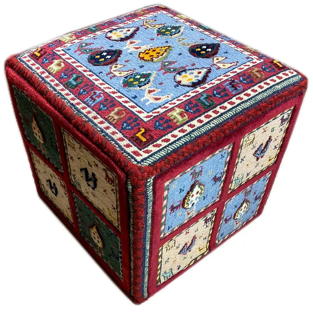 Carpet cube diagonally with a blue lid and side panels in green, beige, and red