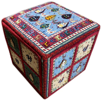 Carpet cube diagonally with a blue lid and side panels in green, beige, and red
