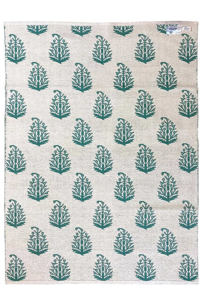 Modern kilim rug with a beige base and green tree pattern, rectangular