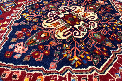 Close-up of the ornamental pattern in dark blue, red, and gold tones with many details