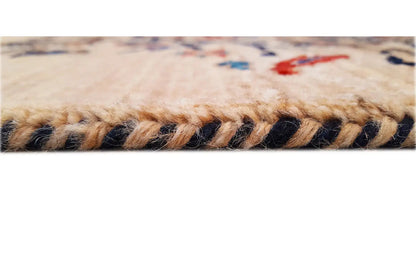 Carpet edge with fringe; beige pile and dark threads along the edge