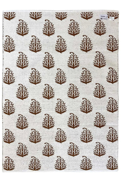 Ecru-colored kilim with brown tree motifs in an all-over design