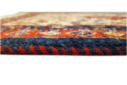 Oriental rug with a multicolored striped pattern and dark pile edge, side view