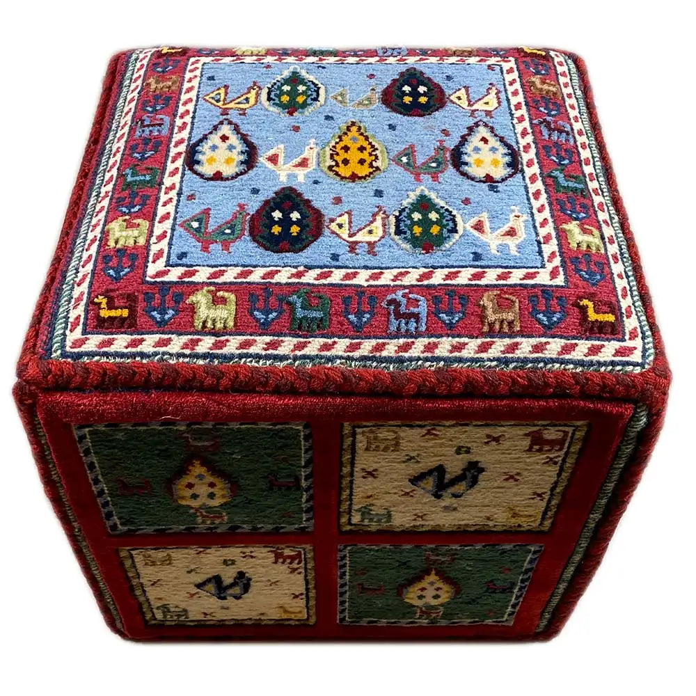Carpet cube with colored patterned squares on the front and top, red border