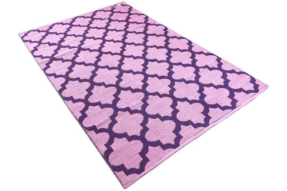 Diagonally draped kilim, purple pattern with pink clover elements in the repeat