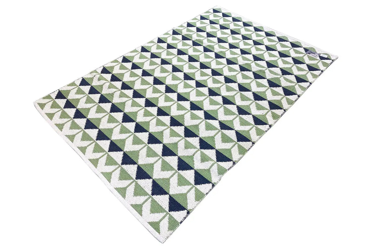 Modern kilim rug with a geometric pattern in green, blue, and white, angular