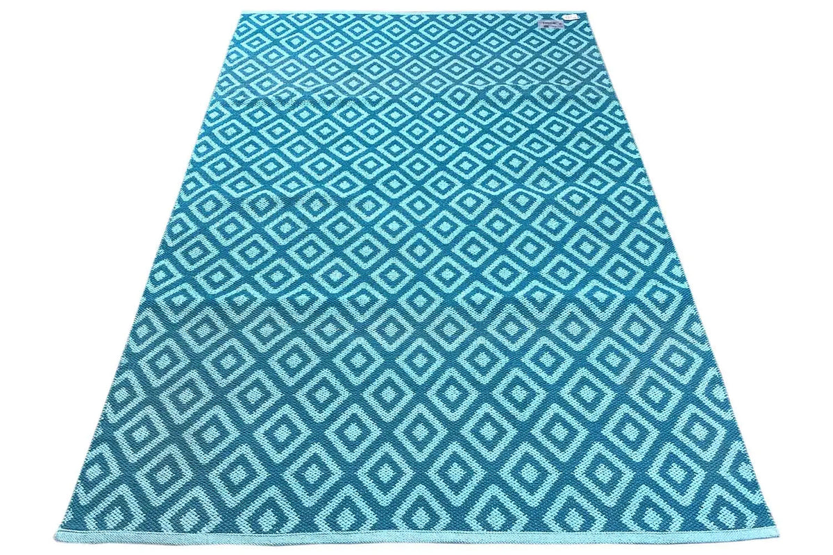 Modern blue kilim rug with a geometric diamond pattern