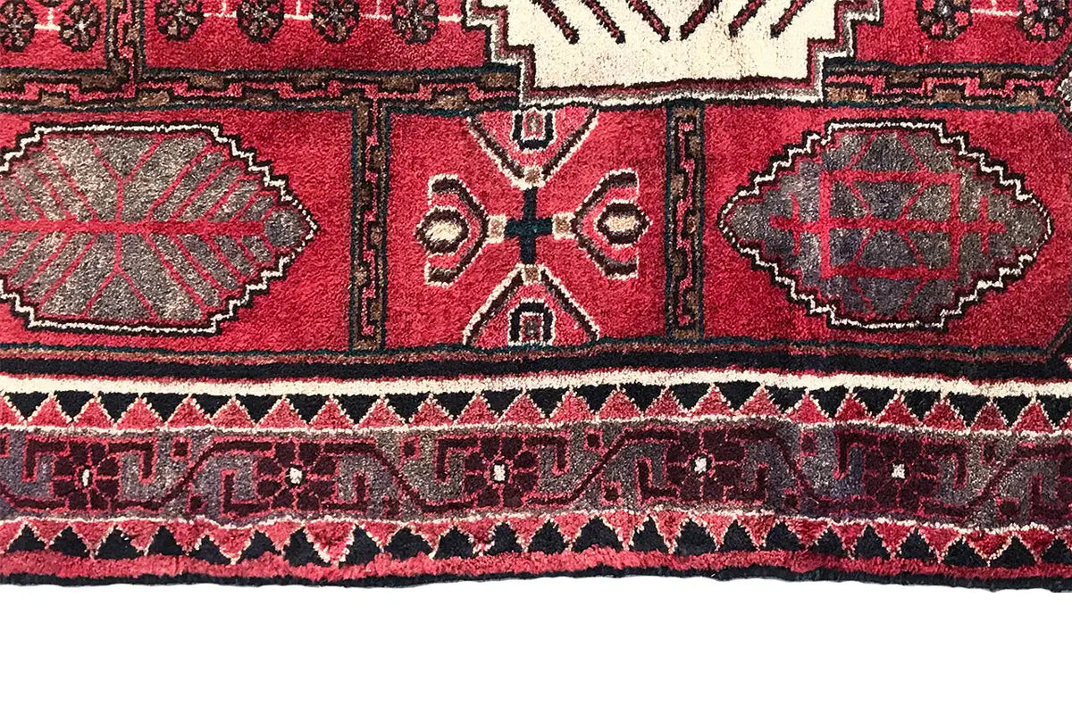 Hamadan runner side view with row patterns in red, black and white