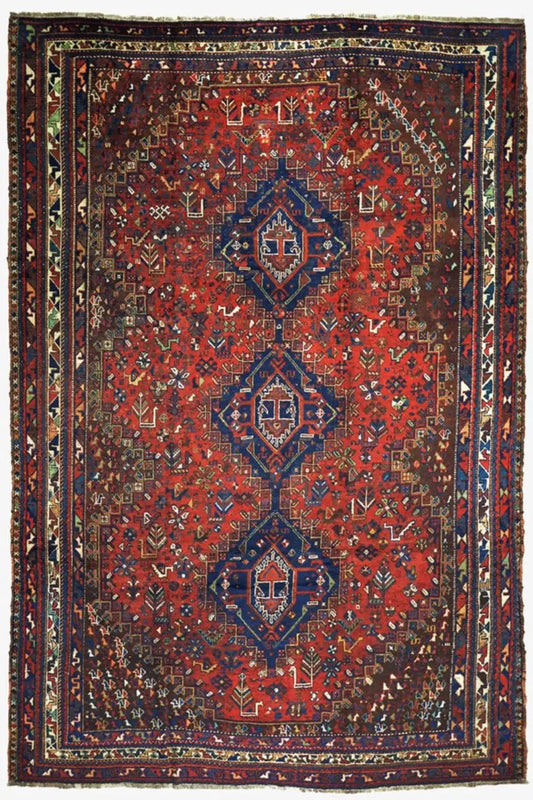 Oriental rug with a dark red pattern and multicolored ornaments, bordered in a rectangle