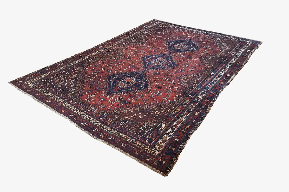 Oriental rug with a dark red geometric ornamental pattern, rectangular, spread out diagonally
