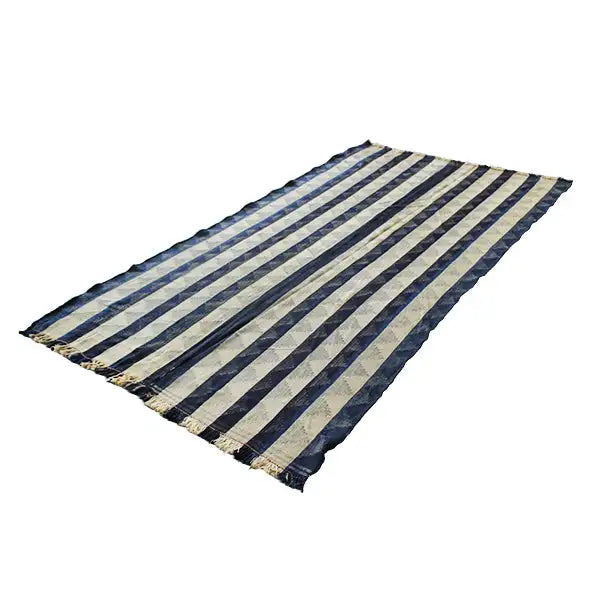 Jajim rug with dark blue and beige stripes, laid out rectangularly, with fringes