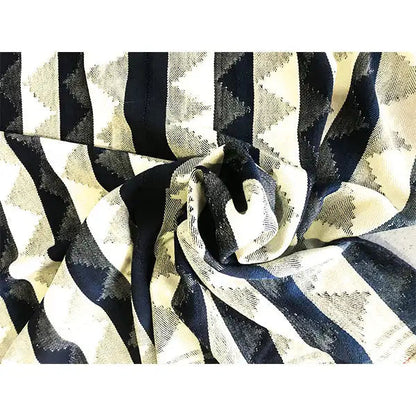 Close-up of a jajim rug: blue-beige stripes with a woven texture, rolled up