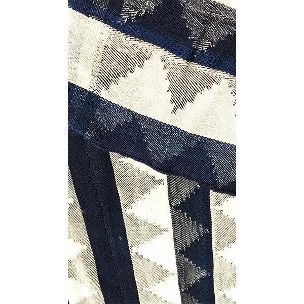 Jajim rug detail: muted blue and beige tones in a block-stripe design