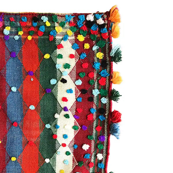 Jajim rug corner with colorful diamond patterns, decorative tassels and fringes