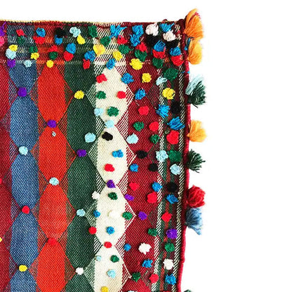 Jajim rug corner with colorful diamond patterns, decorative tassels and fringes