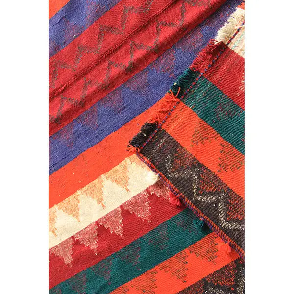 Jajim rug with red, blue, and green stripes, fringes, and patterned areas