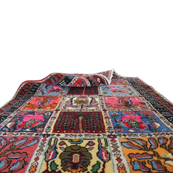 Colorfully patterned carpet with red, blue, and yellow ornaments along the edge, close-up