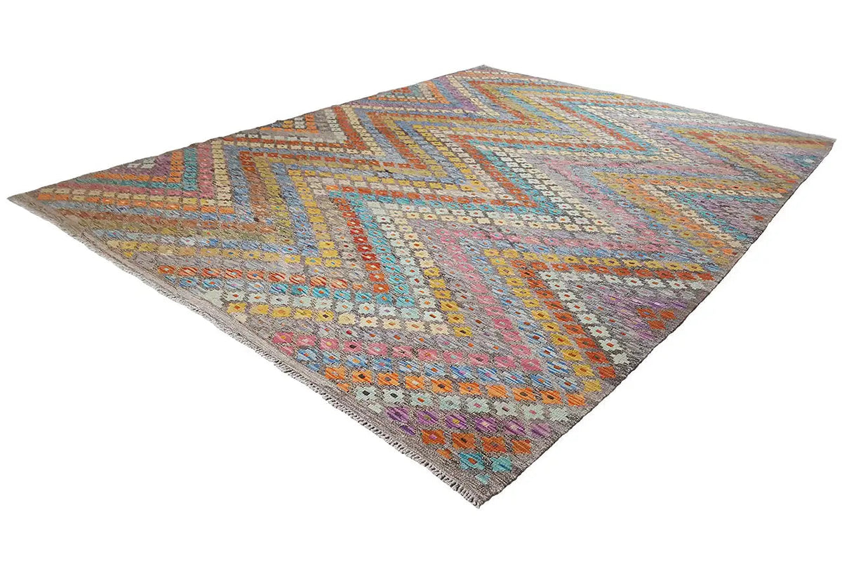 Afghan kilim in diagonal view, geometric diamonds in blue, orange, and violet