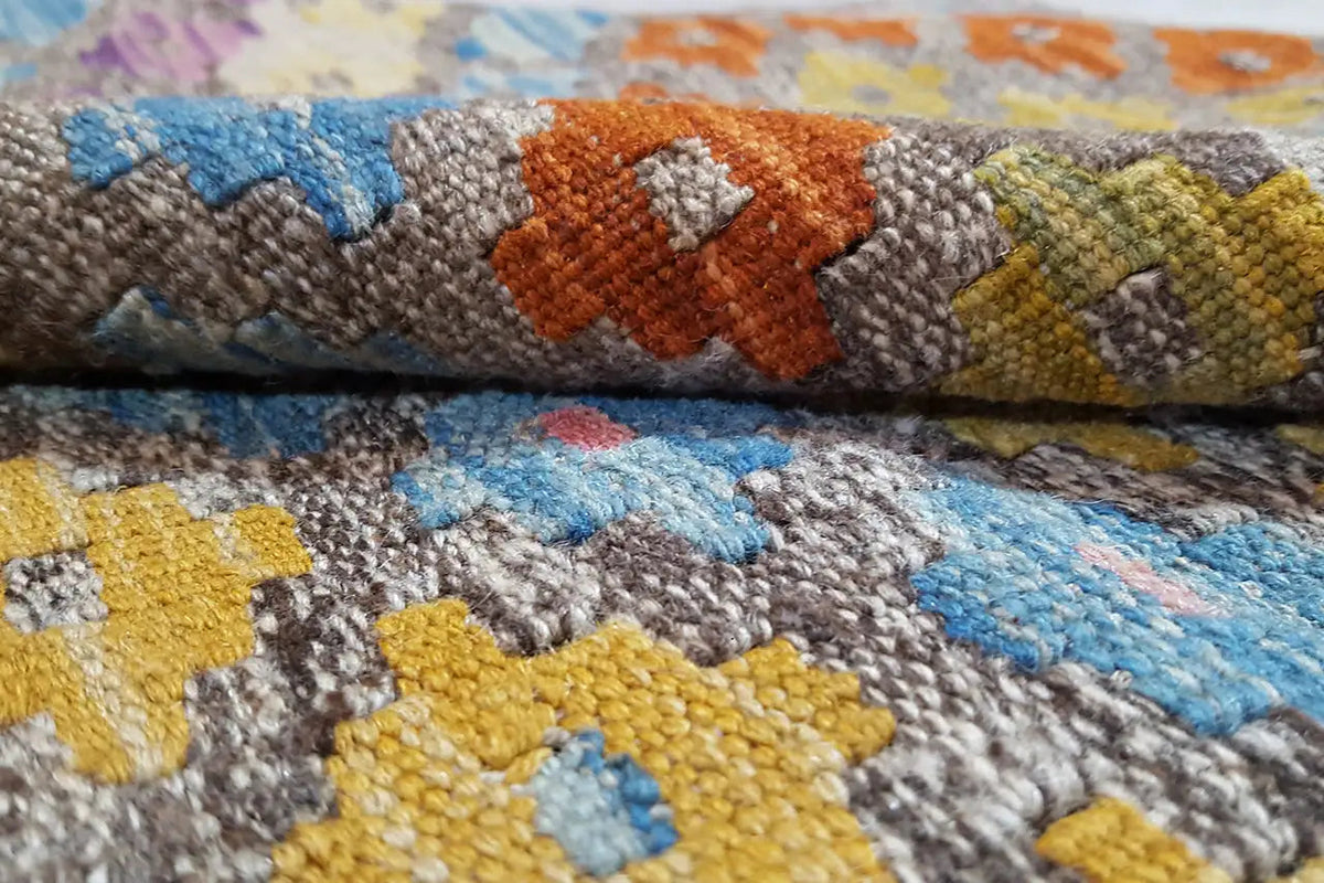 Afghan kilim detail: loop-like pile surface with colorful patterned squares