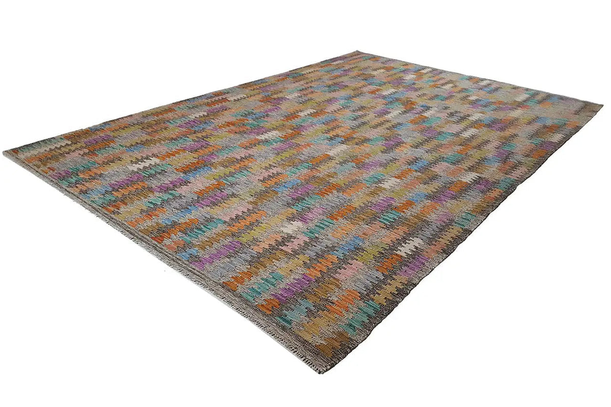 Kilim rug in three-quarter view, multicolored zigzag design