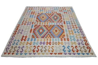 Rectangular kilim rug with geometric patterns, multicolored on a light background.