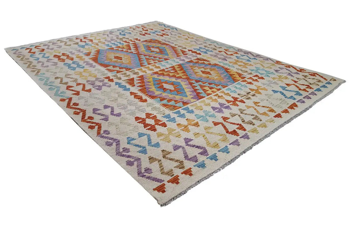 Kilim rug with central medallion and zigzag pattern, in orange, blue, purple, and beige.