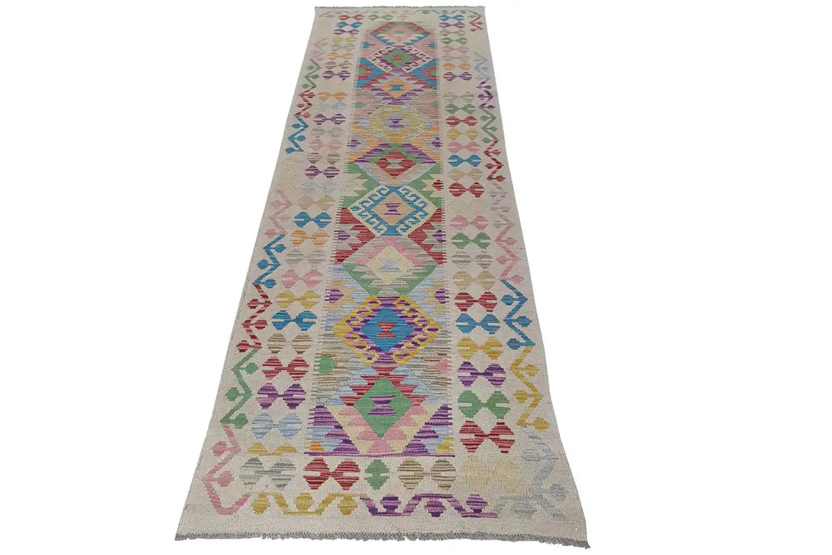 Afghan kilim runner with geometric diamonds in vibrant colors, rectangular