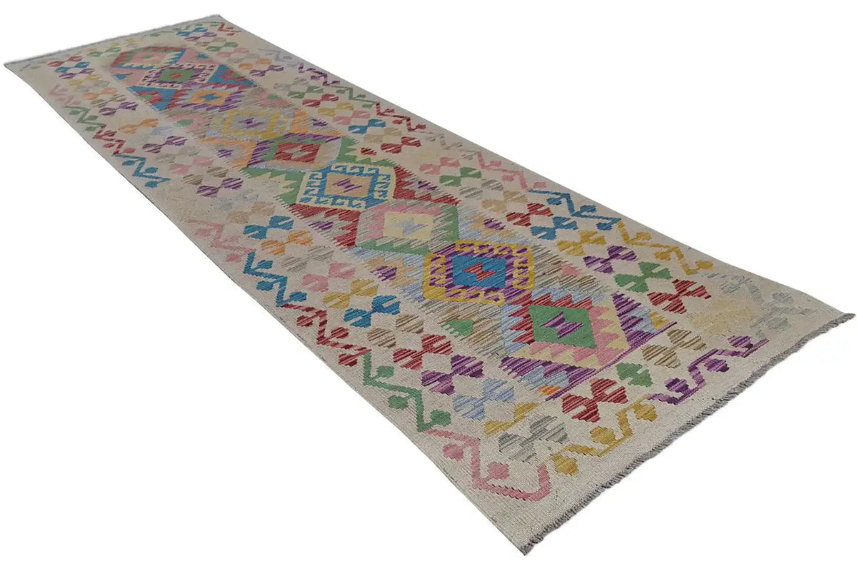 Kilim runner with a geometric tribal pattern and diamonds in multicolored shades
