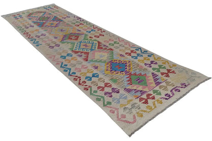 Kilim runner with a geometric tribal pattern and diamonds in multicolored shades