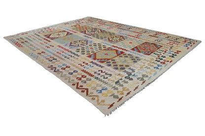 Afghan kilim rug, lying at an angle, geometric patchwork design, multicolored