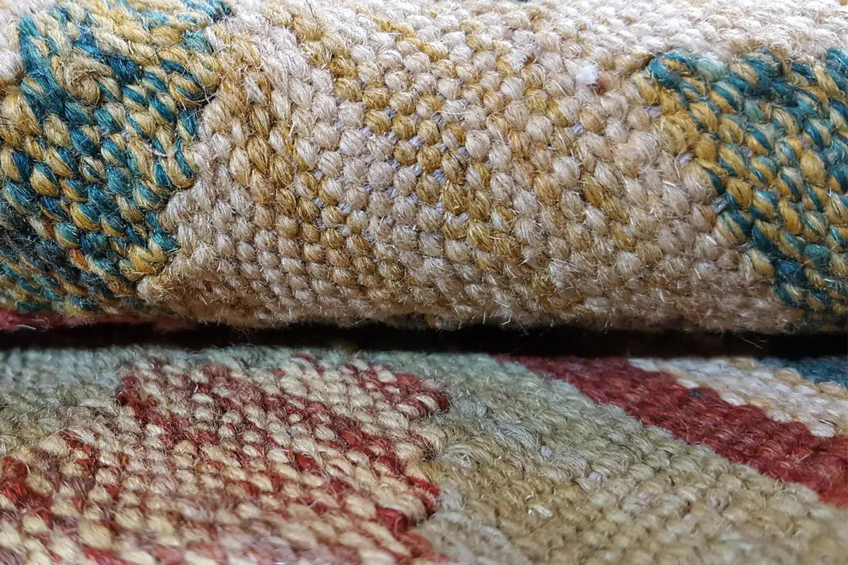 Kilim edge with braided pile and blue-brown accents, close-up
