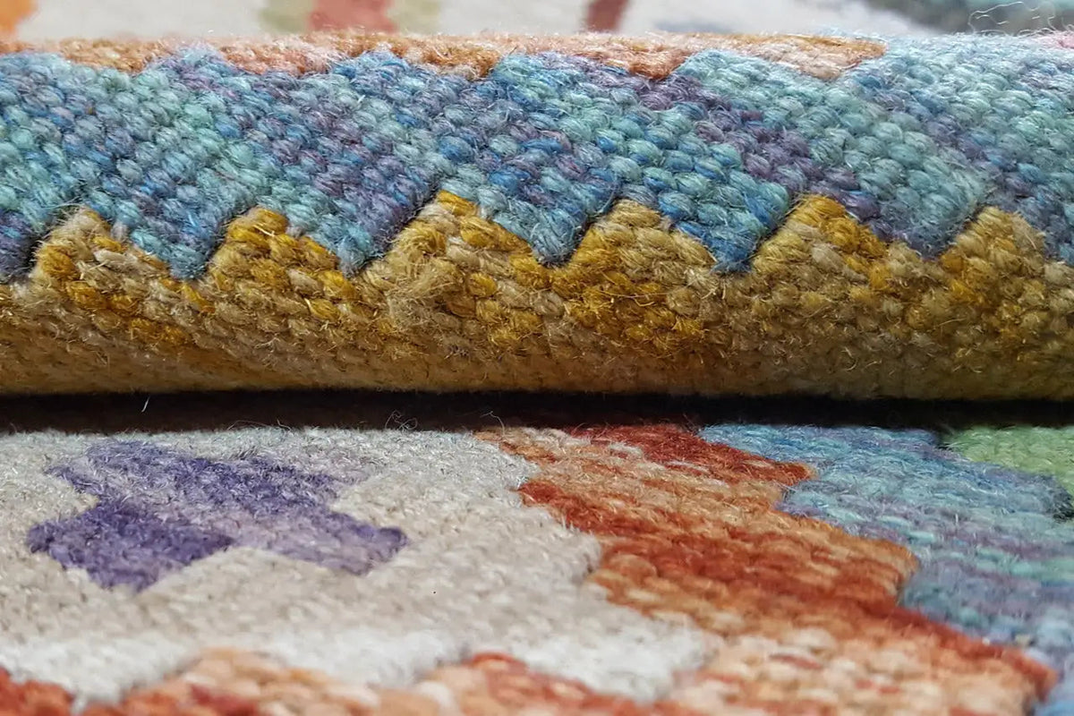 Kelim Afghan rug, close-up of the border with blue and golden-brown threads, fringed