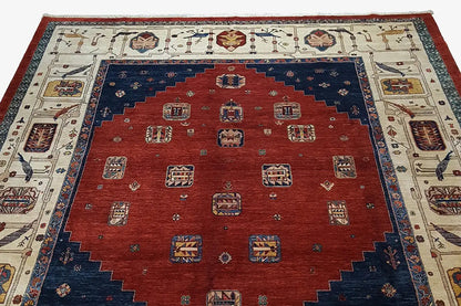 Oriental rug with a red central field, dark blue border, and cream-colored ornaments