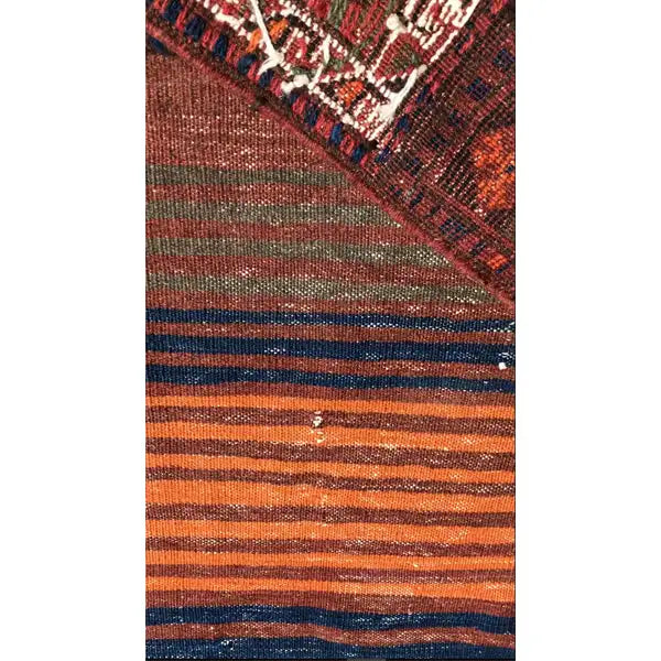 Bakhtiari kilim (238 x 90 cm) Detail of the texture and bands of brown, blue, and orange hues