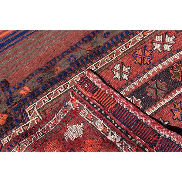 Bakhtiari kilim (238 x 90 cm), close-up: border motifs in red, blue, and cream along the edge