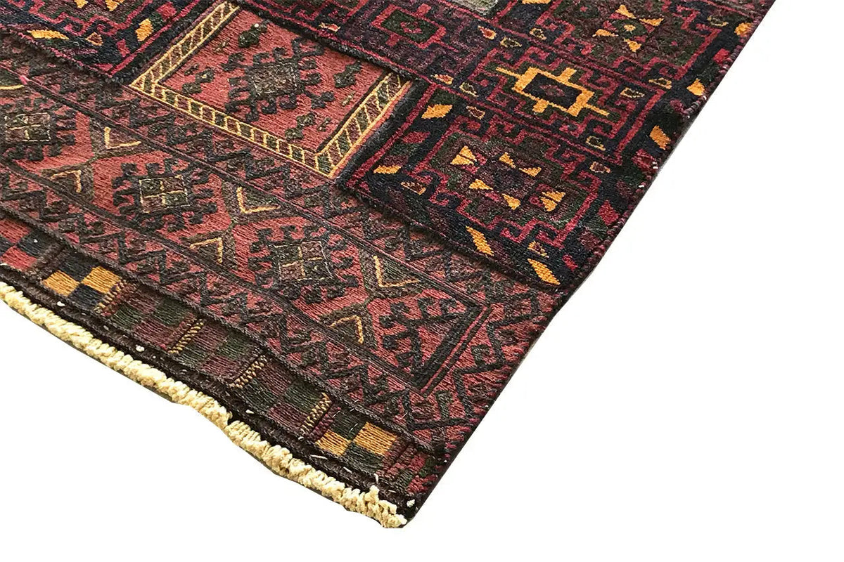 Corner of the Bakhtiari kilim with tightly woven patterns and a bound edge with fringes