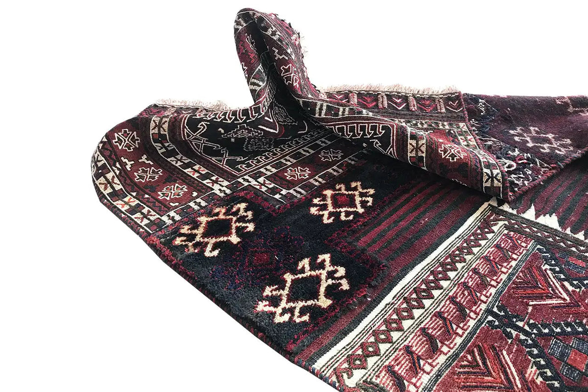 Kelim Bakhtiari rug: folded view with diamond border and zigzag pattern, burgundy and dark blue.