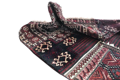 Kelim Bakhtiari rug: folded view with diamond border and zigzag pattern, burgundy and dark blue.