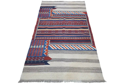 Bakhtiari rug with geometric stripes in blue, red and beige, rectangular, with fringes