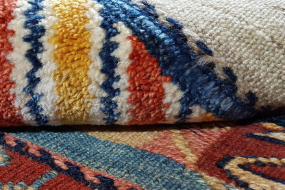 Kelim Bakhtiari detail, woven texture with blue-yellow and red stripe patterns