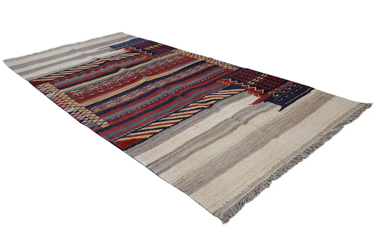 Kilim rug, beige with a geometric border in blue, red, and yellow, with fringes.