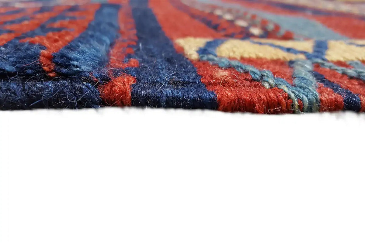 Kilim rug detail at the edge: colorful selvedge with short fringes.