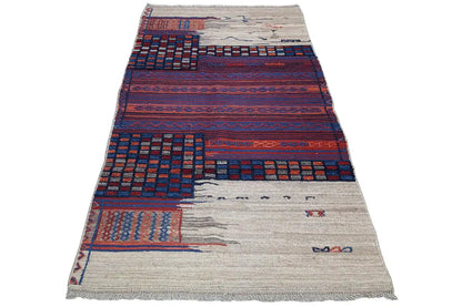 Bakhtiari kilim rug with a geometric pattern in blue, red, and beige, with fringes