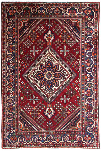 Oriental rug with a red ground and multicolored ornamental medallion, rectangular with a border