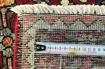 Rug with fringes and measuring tape; weave structure in close-up