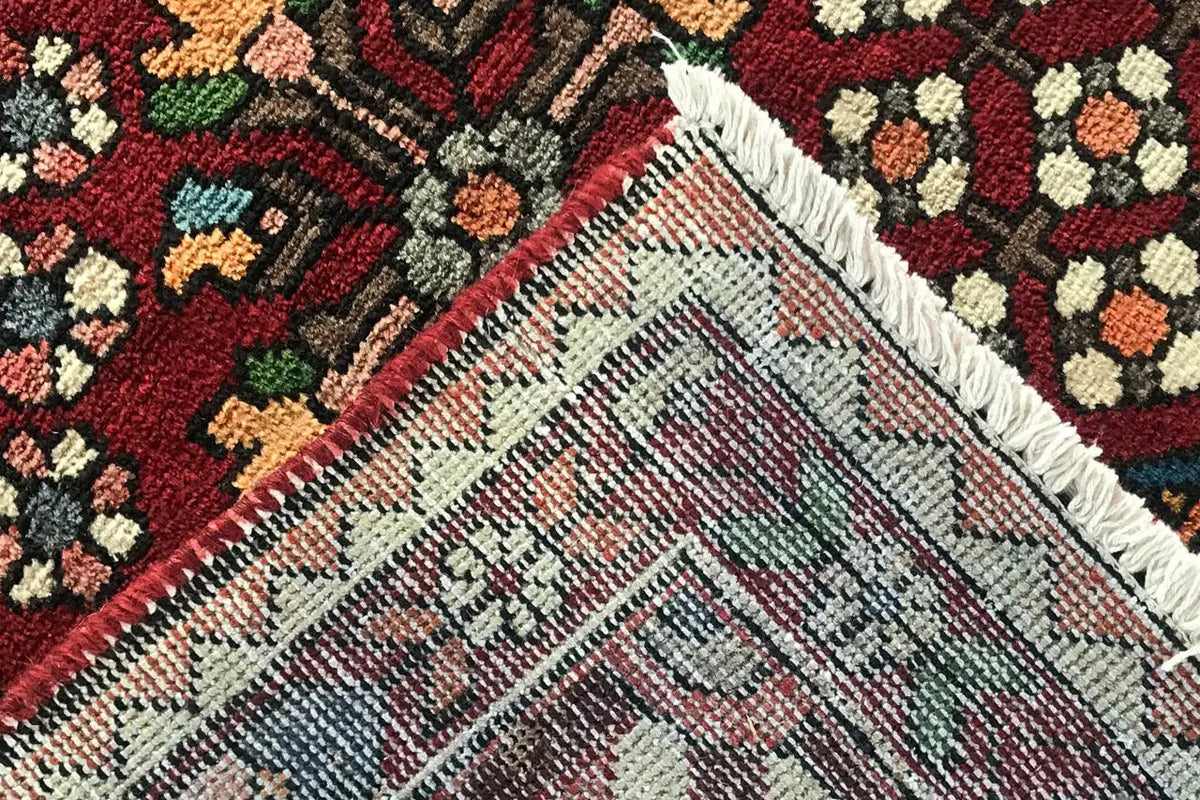 Rug edge: fringe and patterned field with hatching lines, multicolored