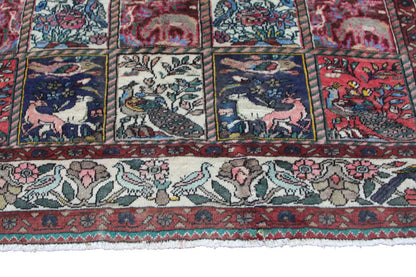 Lower edge of an oriental rug with fringed trim and an all-around patterned border