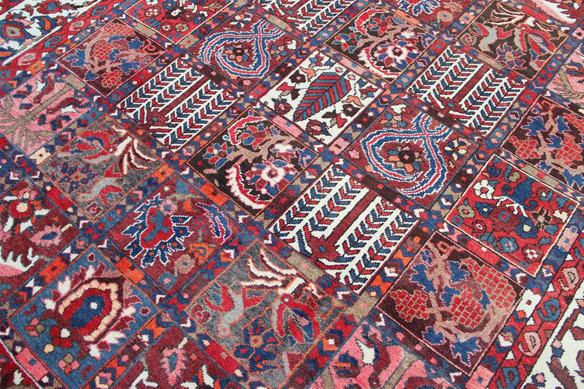 Detailed view of a Bakhtiari rug: geometric ornaments in blue, red, and cream