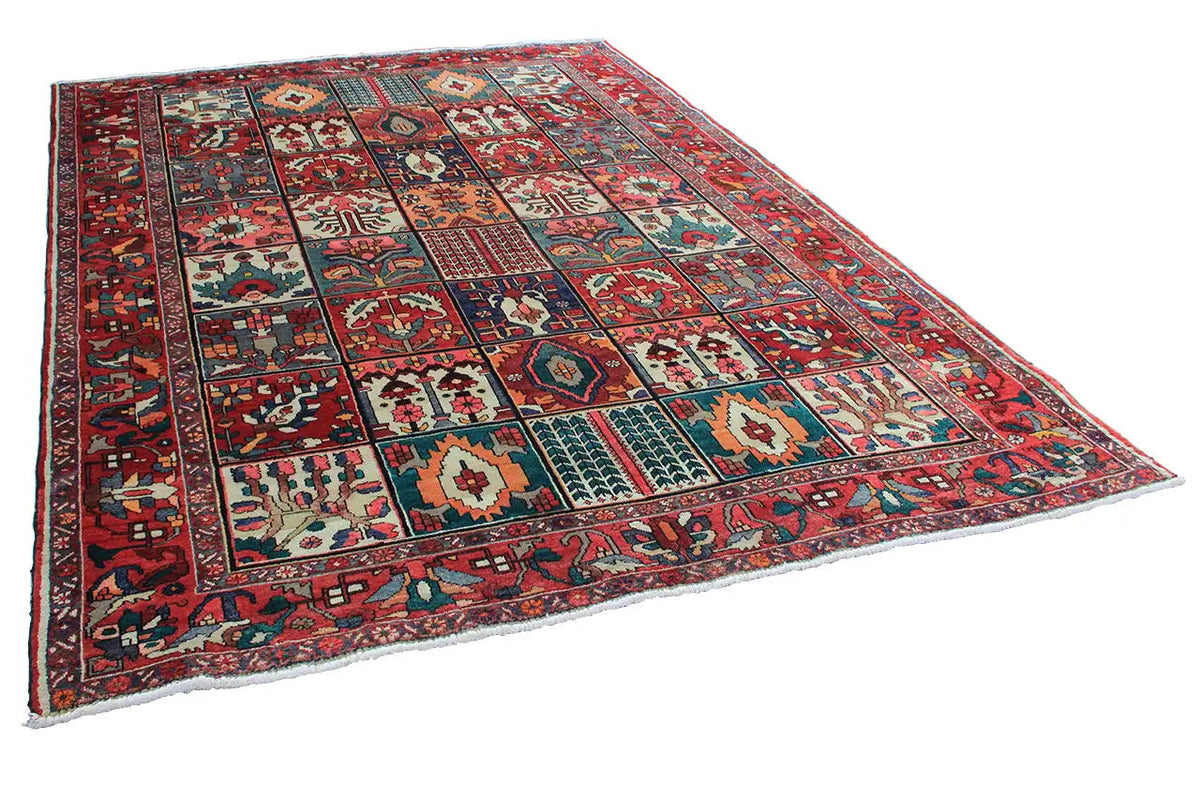 Angled oriental rug with a red border and colorful patterned fields, 315×220 cm
